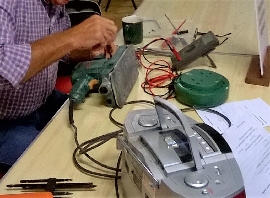 Electric sander being fixed at Tiverton Repair CafÃ©